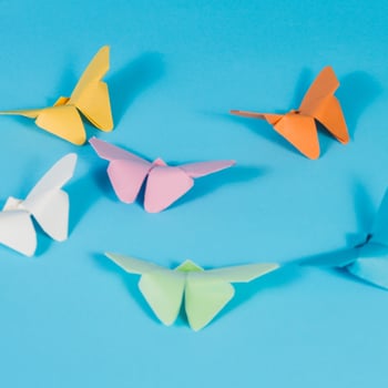 blue-surface-with-paper-butterflies blue-surface-with-paper-butterflies