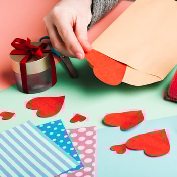high-angle-woman-with-paper-decorations high-angle-woman-with-paper-decorations