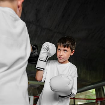 side-view-kid-practicing-boxing side-view-kid-practicing-boxing