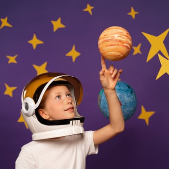 side-view-kid-touching-planet_noglitter side-view-kid-touching-planet_noglitter