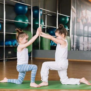 two-girl-child-exercising-together-gym two-girl-child-exercising-together-gym