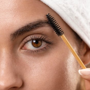 young-woman-taking-care-her-eyebrows young-woman-taking-care-her-eyebrows